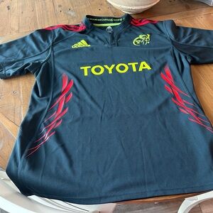 Adidas Munster Rugby. Dark Grey Jersey with Red and Yellow Highlights